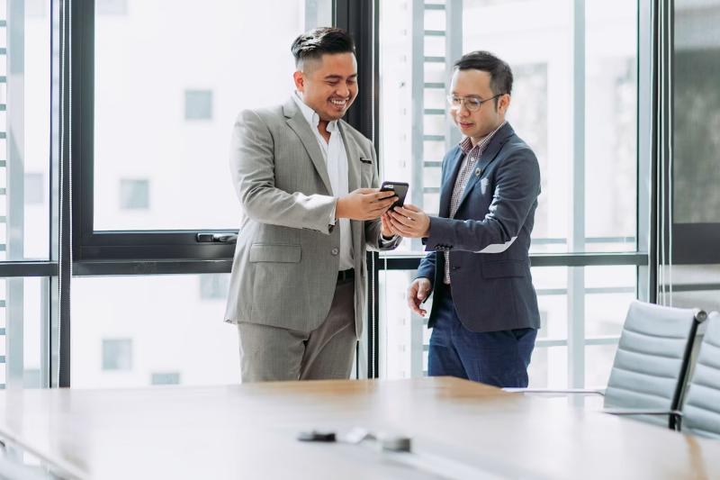 Two Loan Approval Guide advisors reviewing an application
